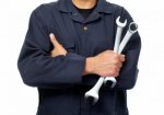 man-holding-two-wrenches.jpg