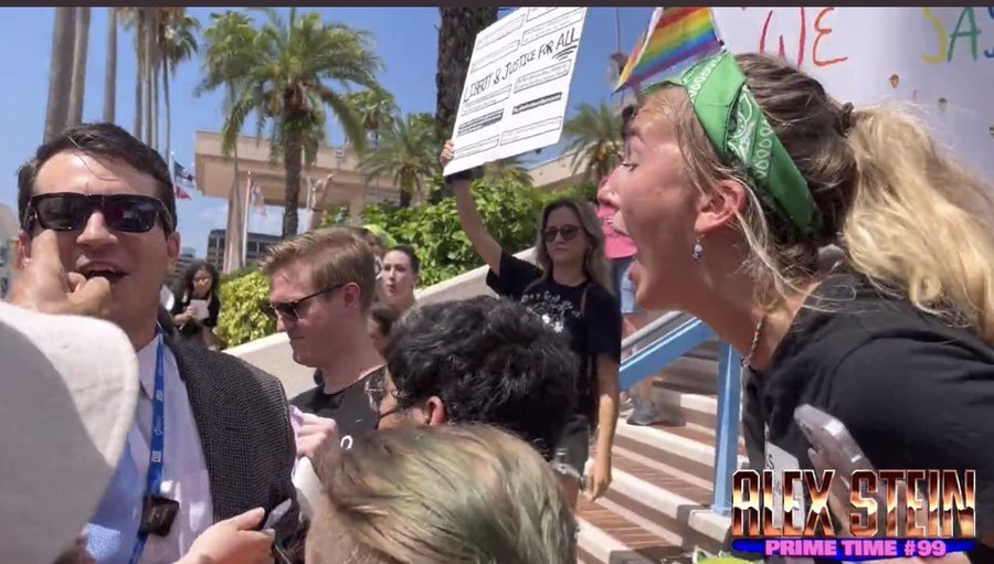 Alex Stein and Protestor.jpg